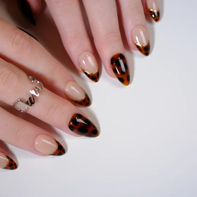Hand-painted tortoiseshell french press-on nails on almond tips